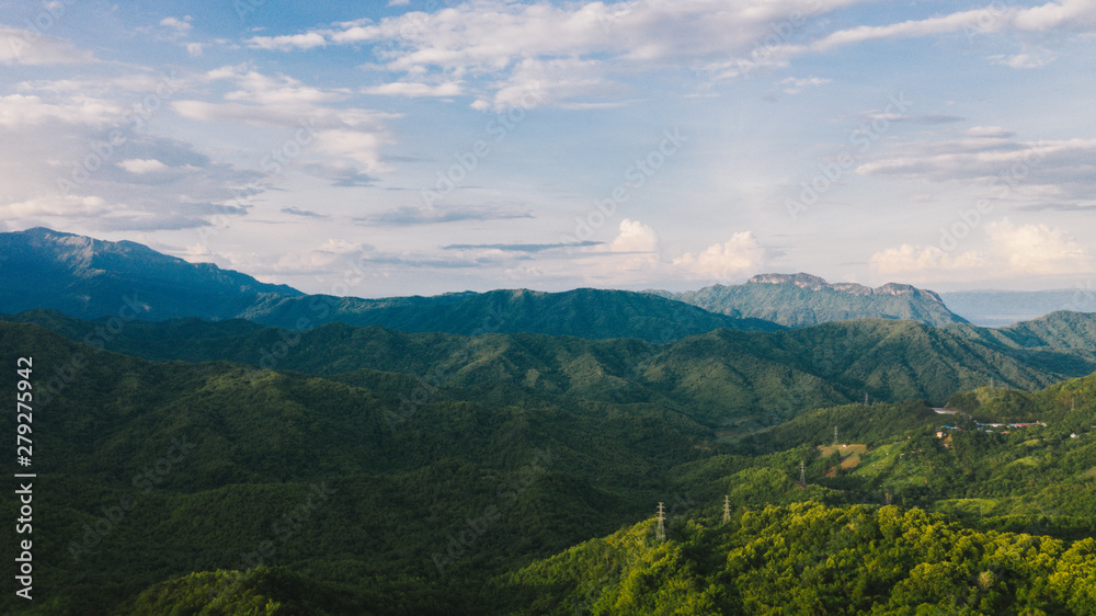 Fototapeta premium Aerial view of mountains and chewed roads on the mountain during sunset at Khao Kho Viewpoint, Phetchabun Province, Thailand