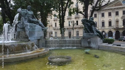 Turin, Piedmont, Italy. July 2019. Filmed with pan movement on the Angelica fountain in Piazza Solferino. The statues that compose it symbolically recall the four seasons. 30fps photo