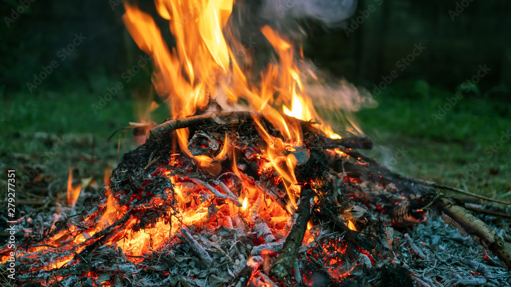 Close up of hot bonfire has hot sparks rise. Close up of hot bonfire has hot sparks rise.