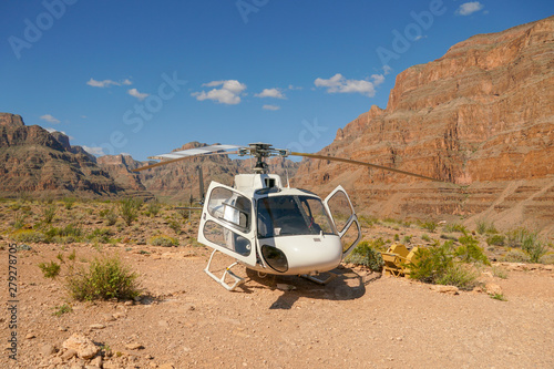 Canvas Print Helicopter parked near the bottom of the Grand Canyon during summer hot day