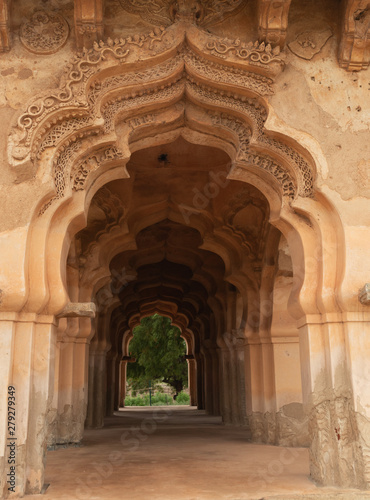 Beautiful carved stone architecture of Lotus Mahal in Hampi, Karnataka, India. © WESTOCK