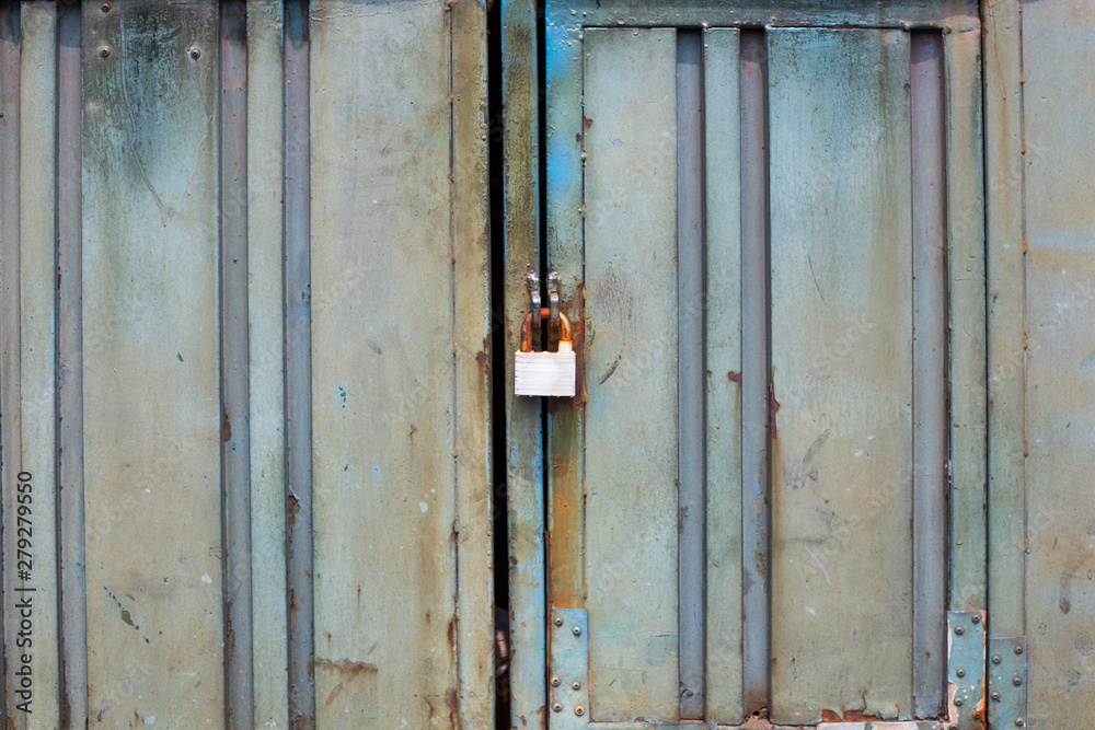 Metal rusty door with lock in grungy style Metal rusty door with lock in grungy style