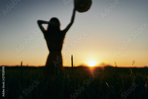 silhouette of young woman doing yoga at sunset © SHOTPRIME STUDIO