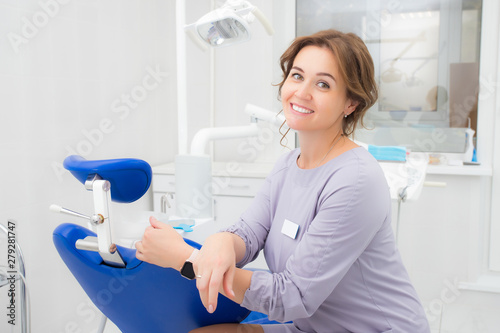 Woman dentist smiling in office