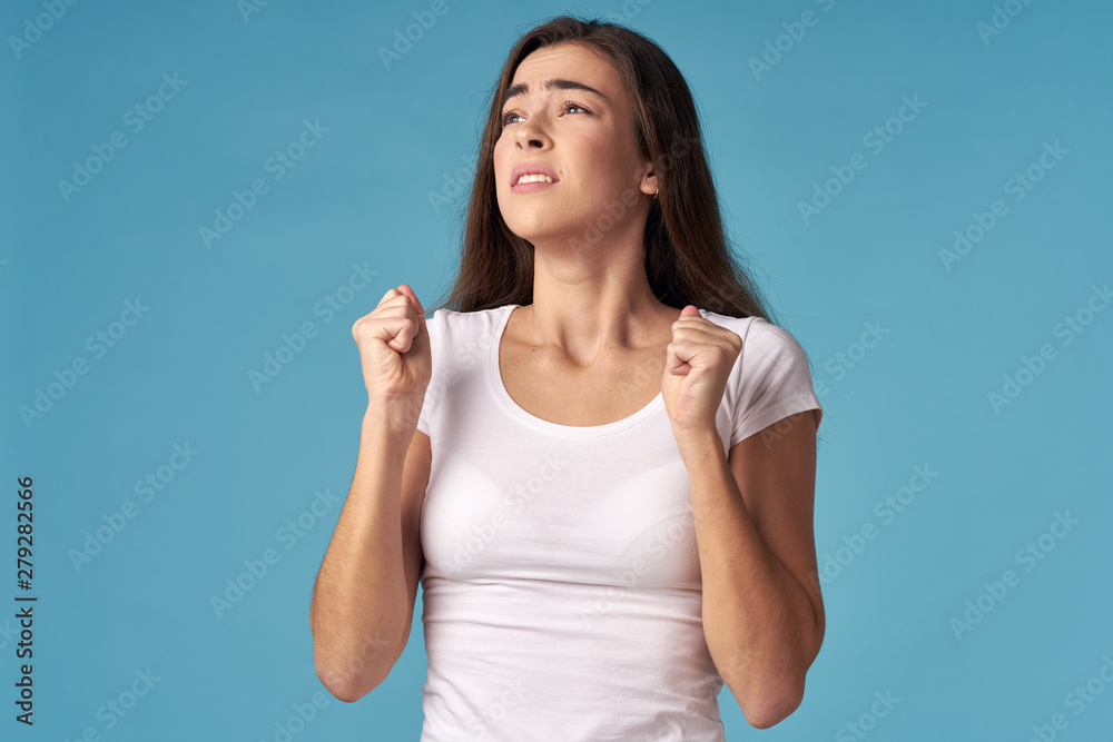 portrait of a young woman pointing up