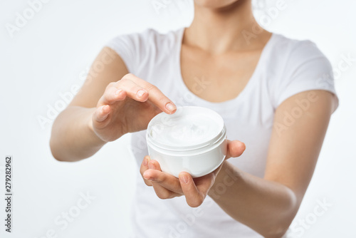 young woman with cup of cream