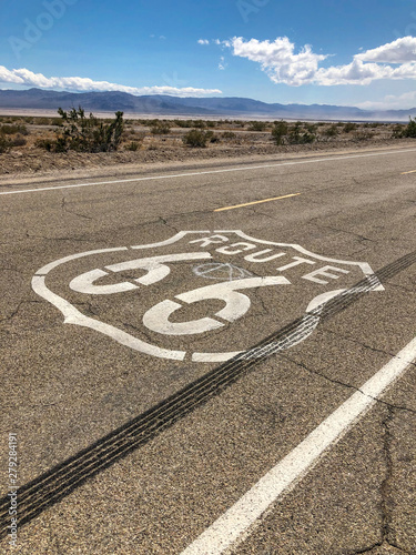 The famous Route 66 emblem painted on Route 66 in the California Desert. 