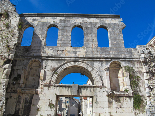 The Silver Gate of Diocletian's Palace in the city Split, Croatia. Old ancient buildings on blue sky background on a sunny day. 