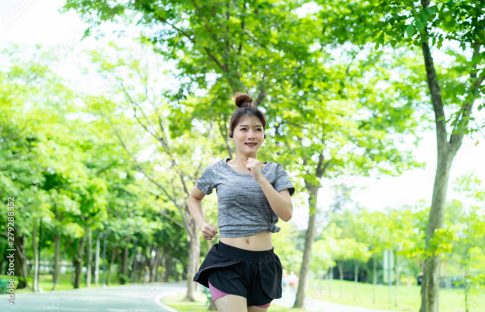 People are exercising at the park with blurry background People are exercising at the park with blurry background