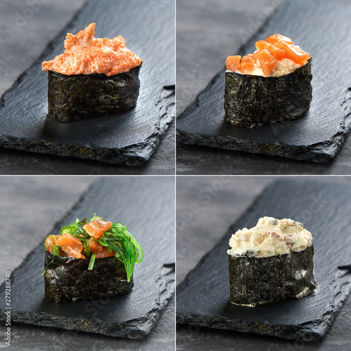 Set sushi gunkan and temaki from salmon, tuna, chukka on black background. Traditional Japanese cuisine photo