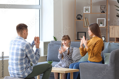 Deaf mute family using sign...