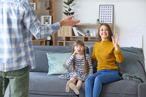 Deaf mute family using sign...