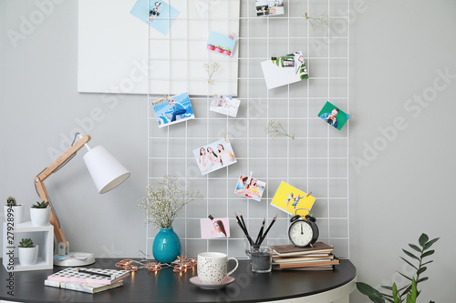 Stylish workplace with mood board at home