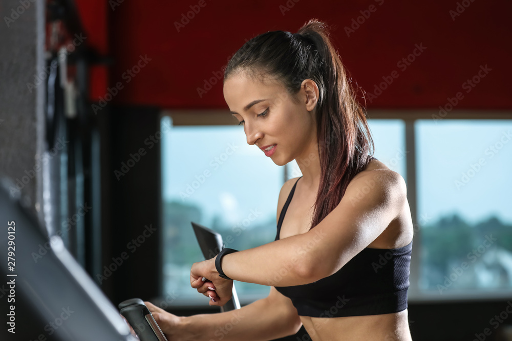 Sporty young woman training in gym Sporty young woman training in gym