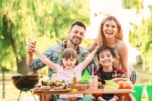 Happy family having picnic ...