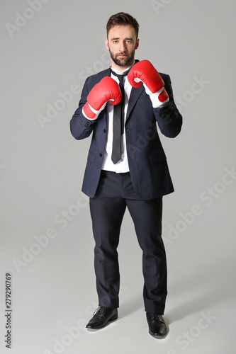 Businessman in boxing glove...