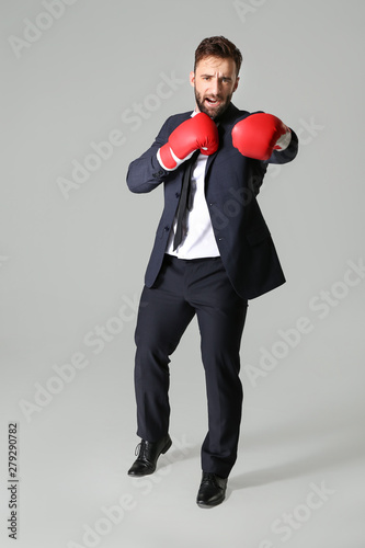 Businessman in boxing glove...