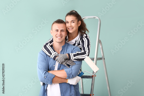 Happy young couple doing re...