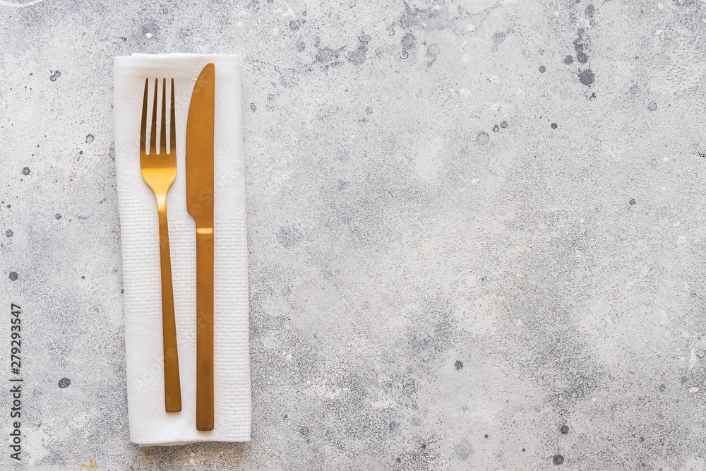 .Table set with gold cutlery knife with fork. Dinning concept background. copy space. .Table set with gold cutlery knife with fork. Dinning concept background. copy space.