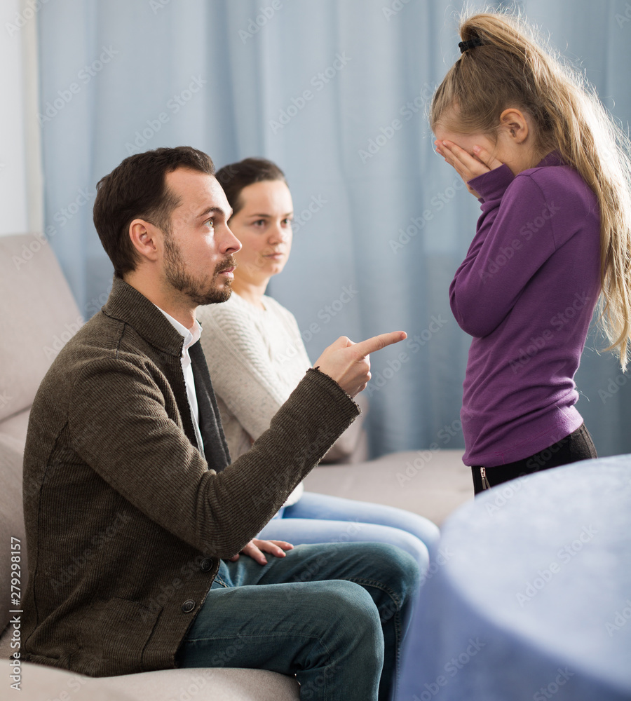 Fototapeta premium Parents lecturing daughter