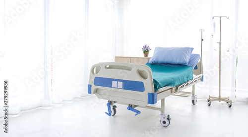 Emtry bed on hospital.blue and white hospital bed on white background. Patient room and insurance concept.