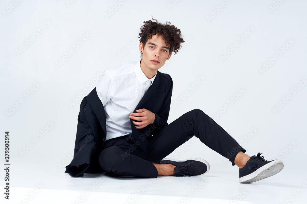 young businessman sitting on the floor with laptop young businessman sitting on the floor with laptop