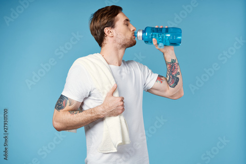 young man drinking water from a bottle