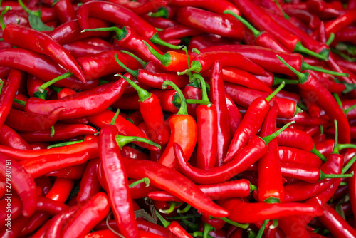 Red hot fresh raw chili peppers in outdoor market