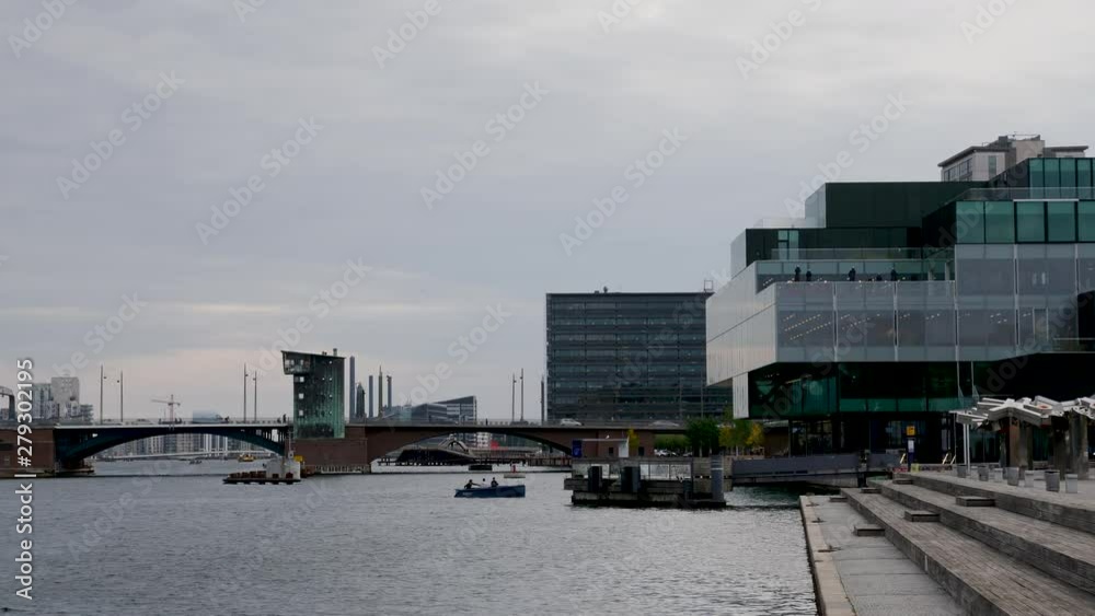 Waterfront panoramic view of landmark bridge with car traffic and naval traffic in the city centre of Copenhagen, Denmark Waterfront panoramic view of landmark bridge with car traffic and naval traffic in the city centre of Copenhagen, Denmark