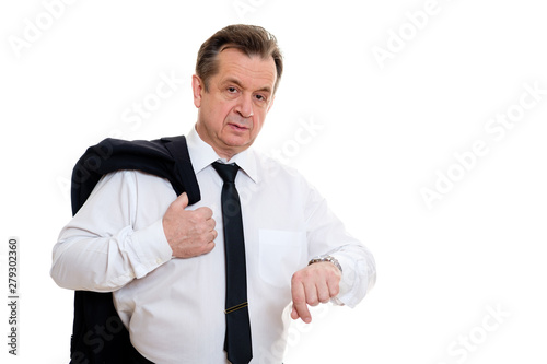 Delaying senior man 60-65 years old with clock on hand. Businessman hold suit on shoulder. on white isolated background.
