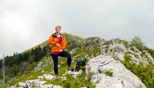 Woman Hiking alone in the mountains 