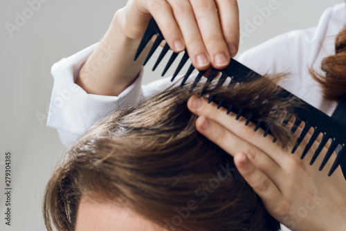 hairdresser cuts hair