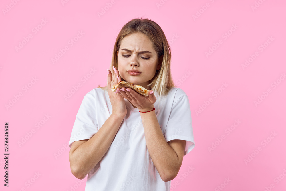 young woman eating pizza