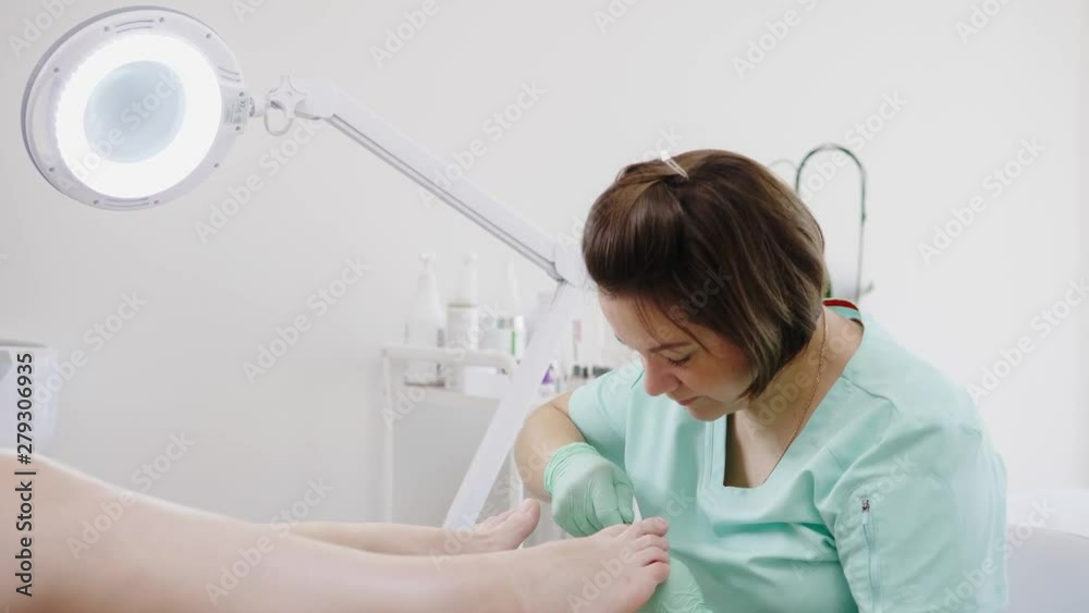 Woman having pedicure at beauty salon Woman having pedicure at beauty salon