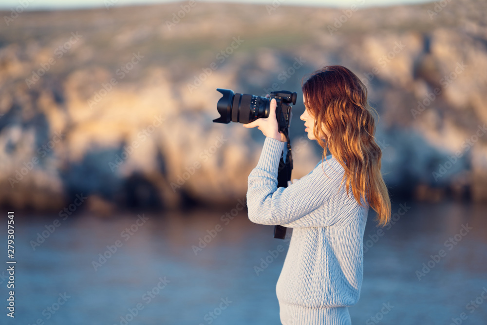 woman taking photo with digital camera