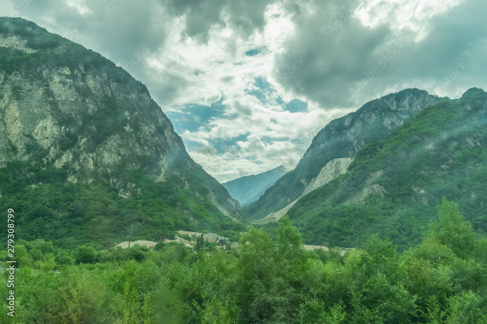 Fototapeta premium Beautiful mountain view with clouds on a sunny summer day