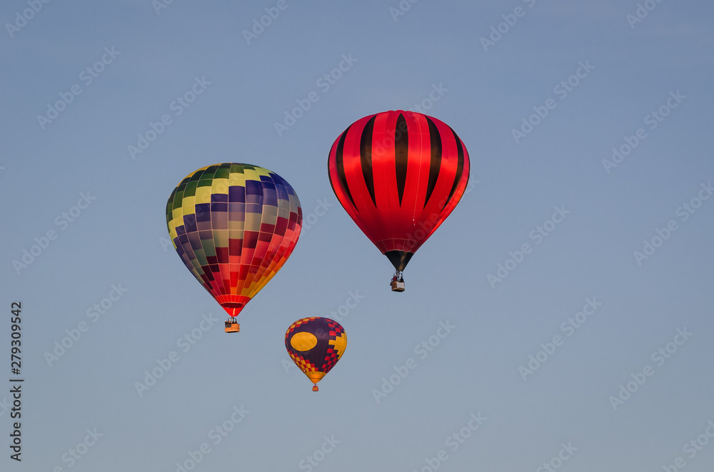 FESTIVAL OF BALLOON SPORT LOVERS - Flight of balloons on a blue sky FESTIVAL OF BALLOON SPORT LOVERS - Flight of balloons on a blue sky