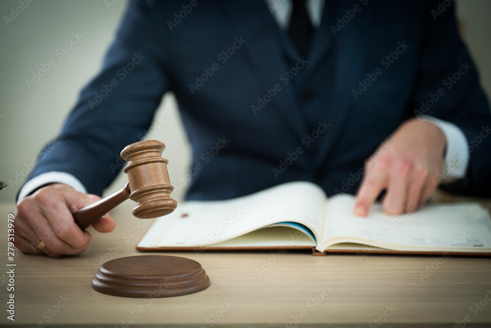 Lawyer businessman working or reading lawbook in office workplace for consultant lawyer concept.