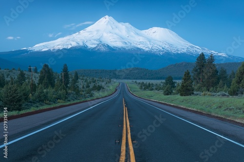 Road towards Mounts Shasta and Shastina in California, United States Highway 97 in Northern California heading South toward a mountain called Shasta volcano, USA Classical view on beautiful volcano