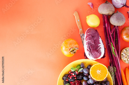 Selective of fall winter antioxidant ingredients and vegetables, cereals rich of anthocyanins, oligominerals for healthy seasonal cooking on colored background photo