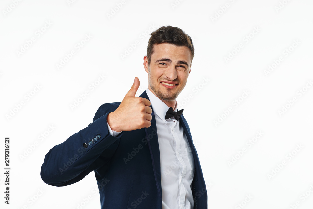 portrait of a young businessman with thumb up portrait of a young businessman with thumb up