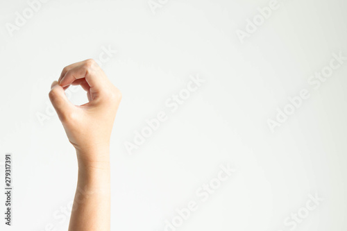 Wallpaper Mural A hand making circle shape; or showing number zero by using thumb touching other fingers on white background. Torontodigital.ca