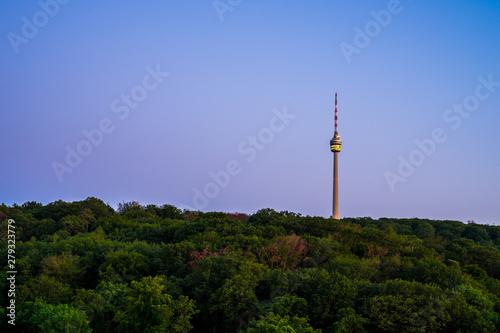 Germany, Famous television tower called fernsehturm of stuttgart city in dawning twilight mood surrounded by endless green forest