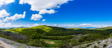Montenegro, XXL panorama of green nature landscape of trees and forest forming country scenery near savnik with blue sky in springtime