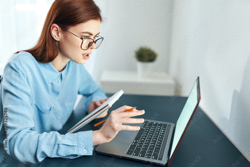 businesswoman working on laptop in office businesswoman working on laptop in office