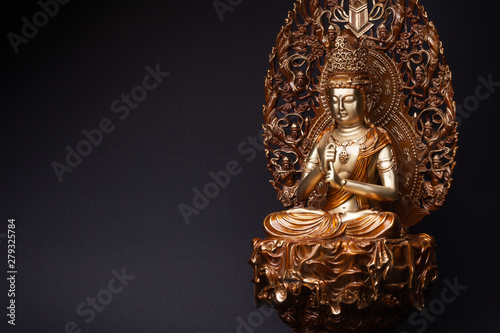 Photos Bodhisattva Guan Yin sitting in the lotus position.
