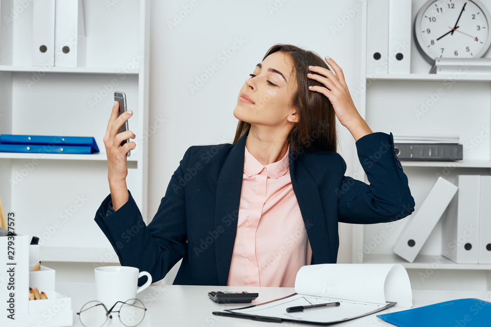 business woman in office with telephone business woman in office with telephone