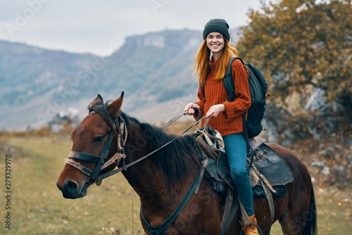woman riding a horse trip