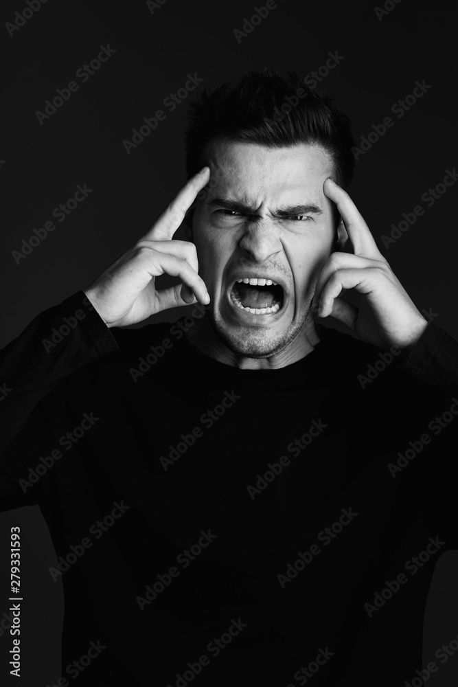 a man with a headache screams