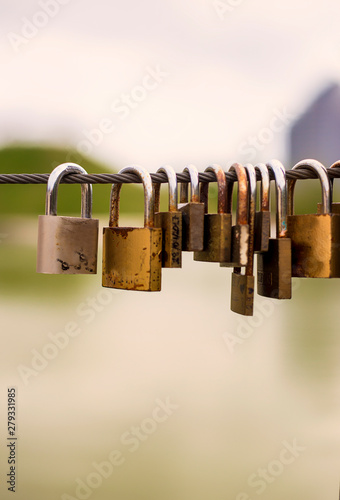 Padlocks interlocked on a port cable photo